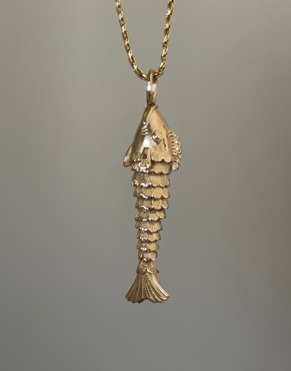 Gold fish-shaped necklace