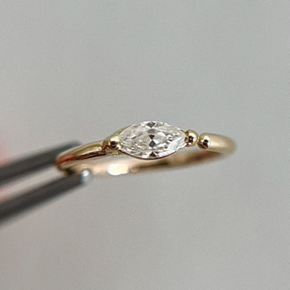 gold helix piercing ring with a diamond or moissanite stone.