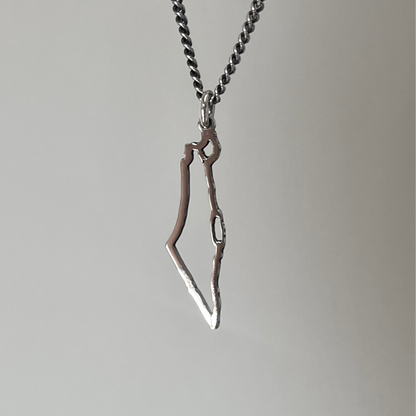 A sterling silver necklace featuring a map of Israel as the pendant.