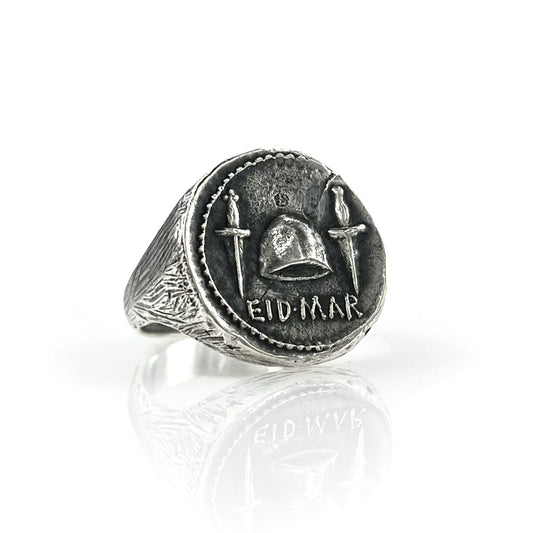 A 925 sterling silver signet coin ring with engraved designs and the text 'EID MAR'.