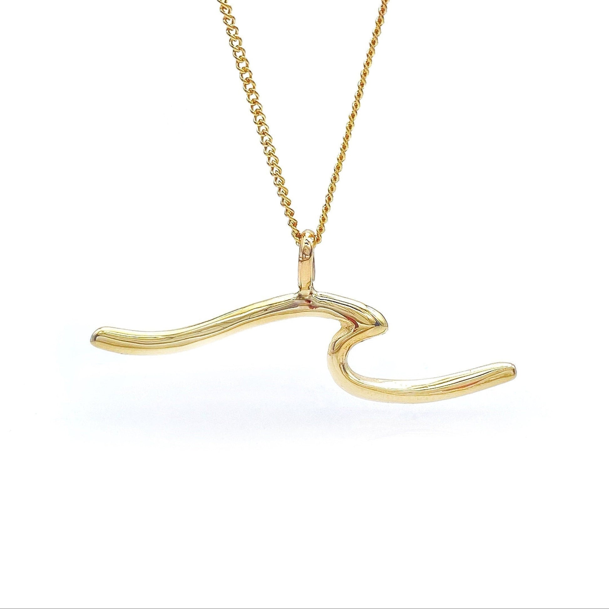 A 14k gold solid wave-shaped pendant necklace with a gold chain.