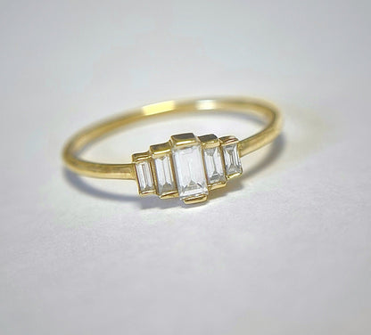 A degrade baguette diamond ring set in 14K gold, displayed against a white background.