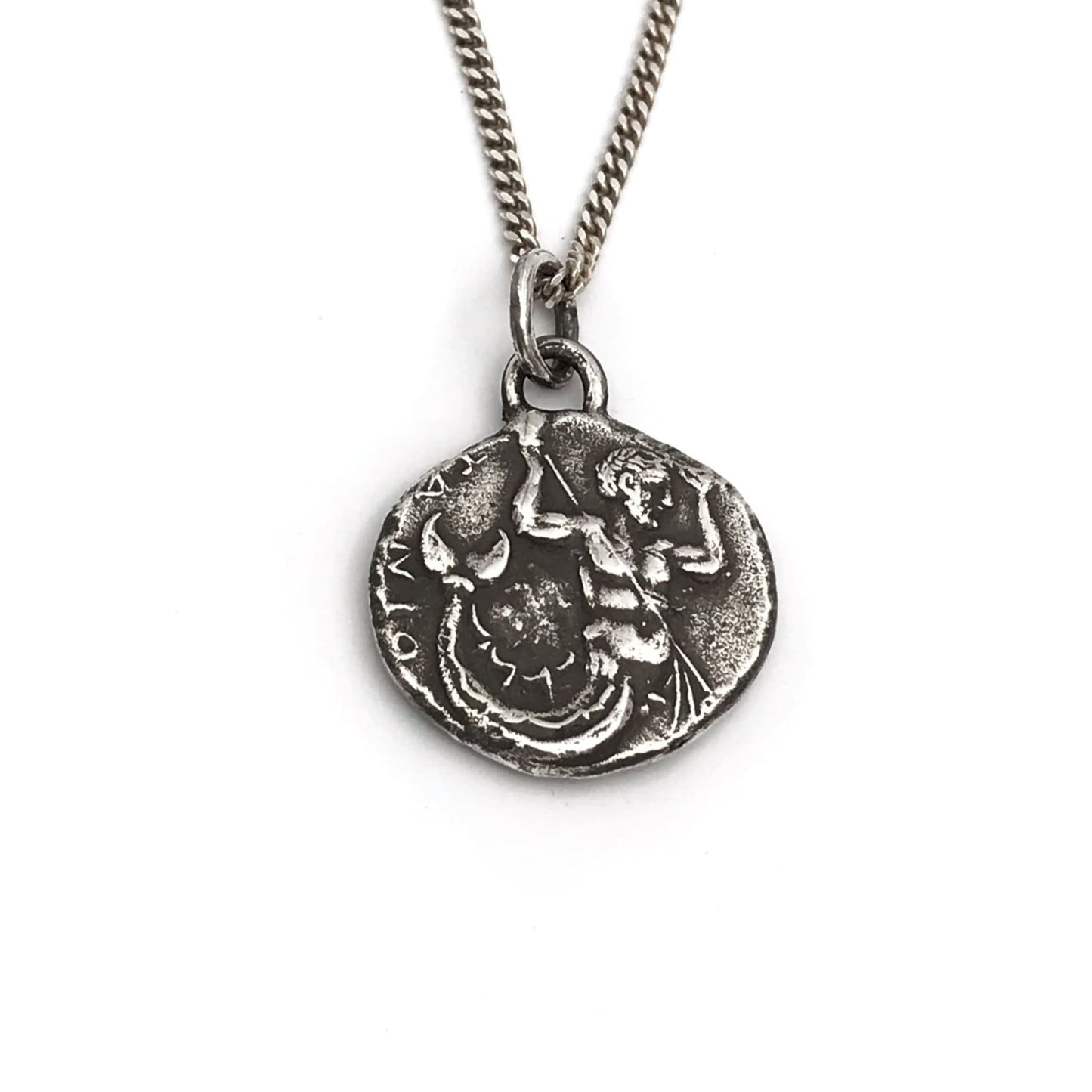 A silver necklace featuring a vintage style Poseidon coin pendant