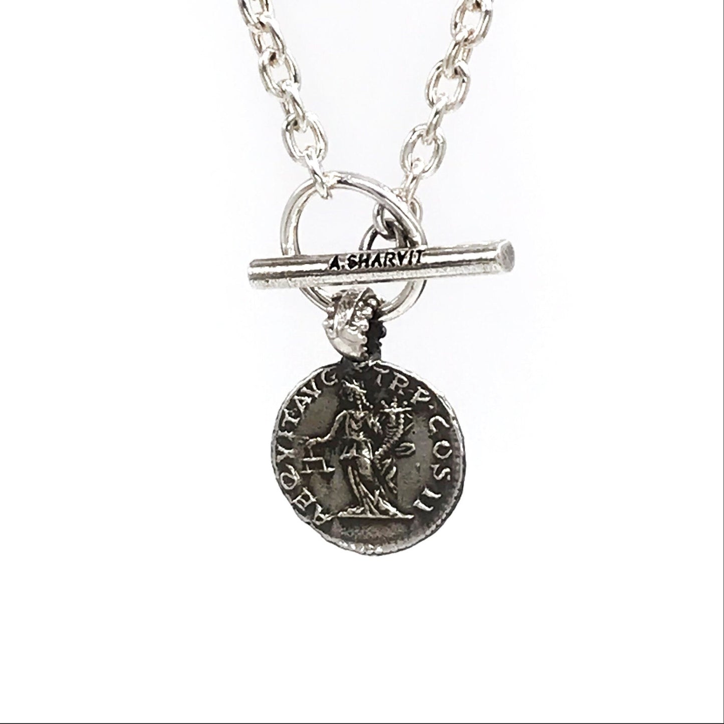 A sterling silver necklace with a pendant featuring an engraved image of Aequitas holding a cornucopia and a balance scale, with a chain of choice.