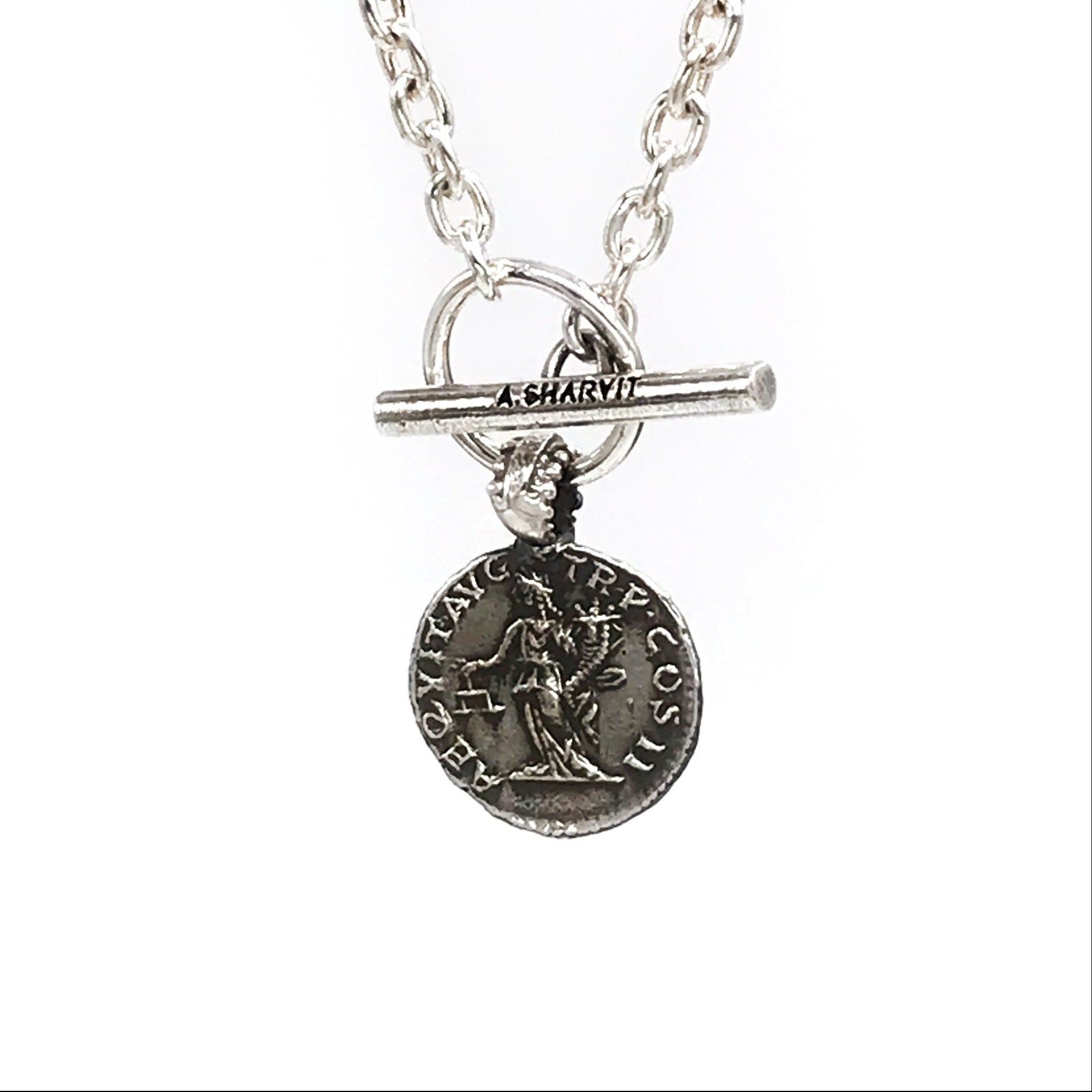 A sterling silver necklace with a pendant featuring an engraved image of Aequitas holding a cornucopia and a balance scale, with a chain of choice.