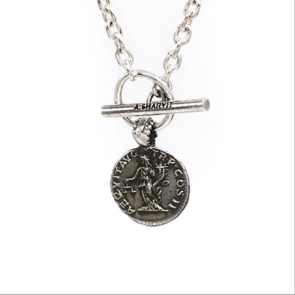 A sterling silver necklace with a pendant featuring an engraved image of Aequitas holding a cornucopia and a balance scale, with a chain of choice.